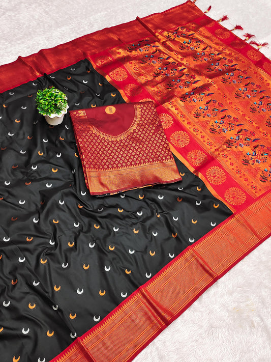 Black and orange saree with a blouse piece on a light gray background